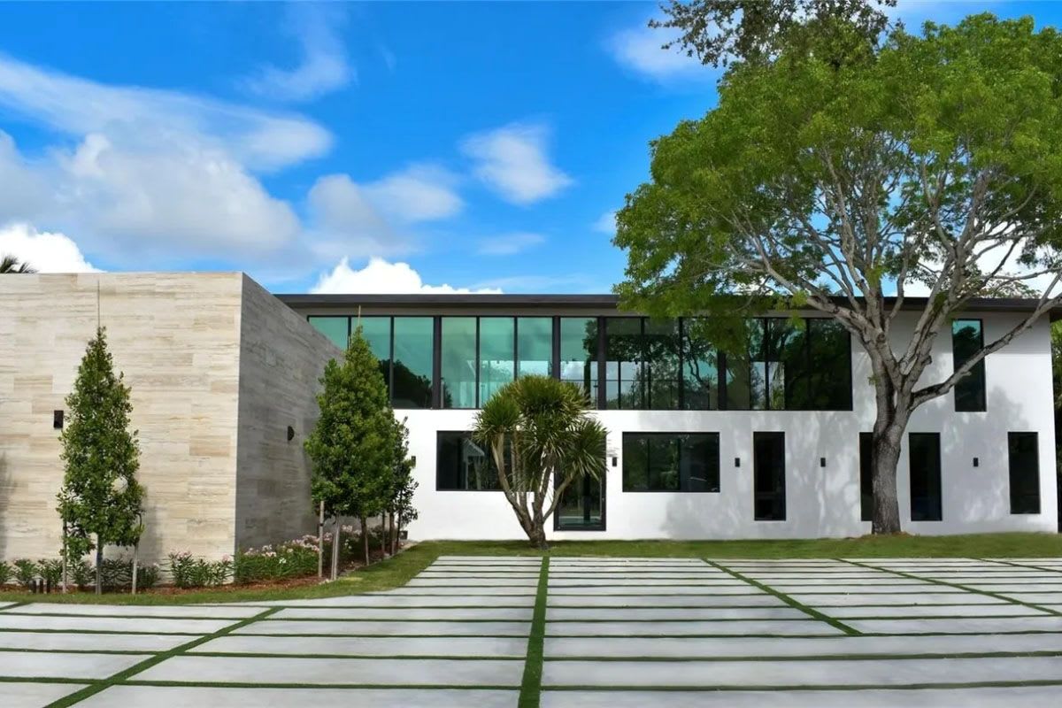front of pool in backyard of a pinecrest florida home