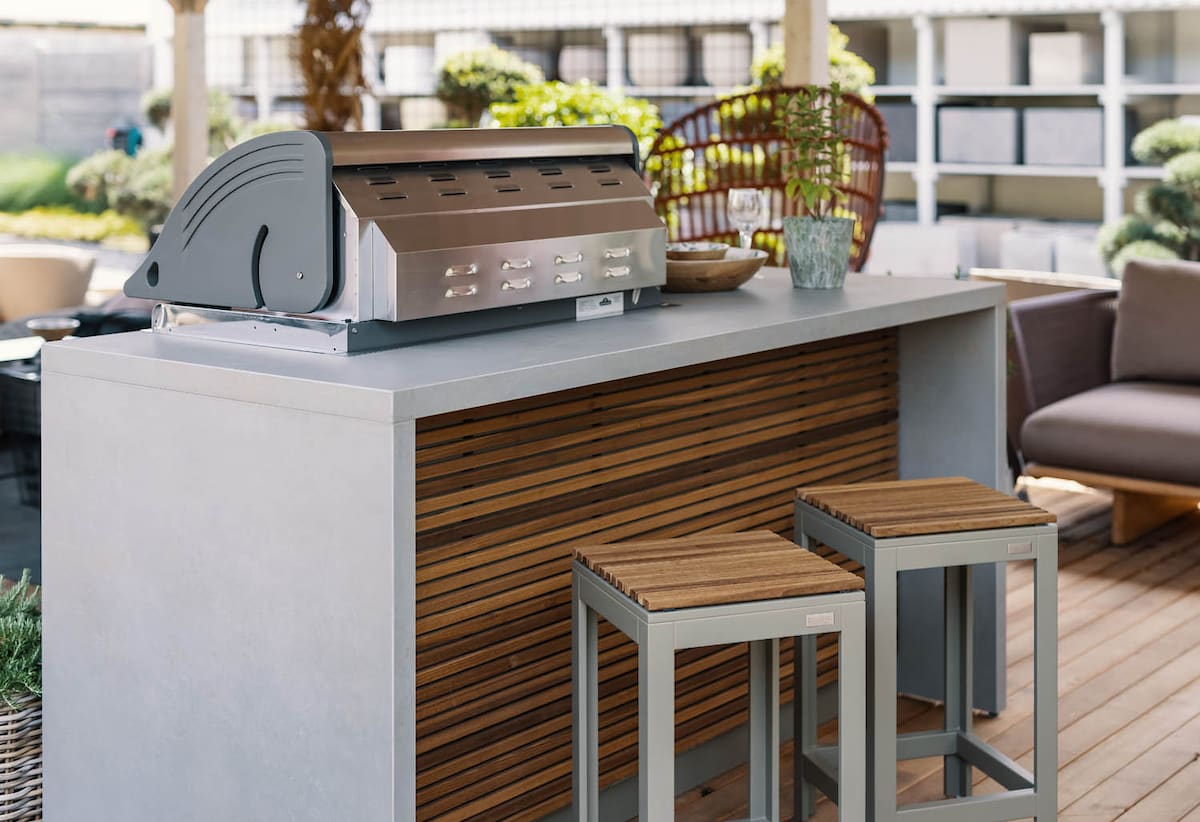 closeup of small wood and white outdoor kitchen island by cubic