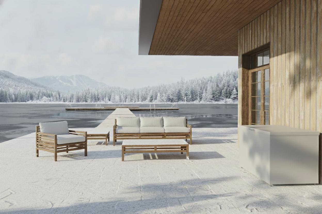 outdoor living area with cubic storage box and furniture covered in snow