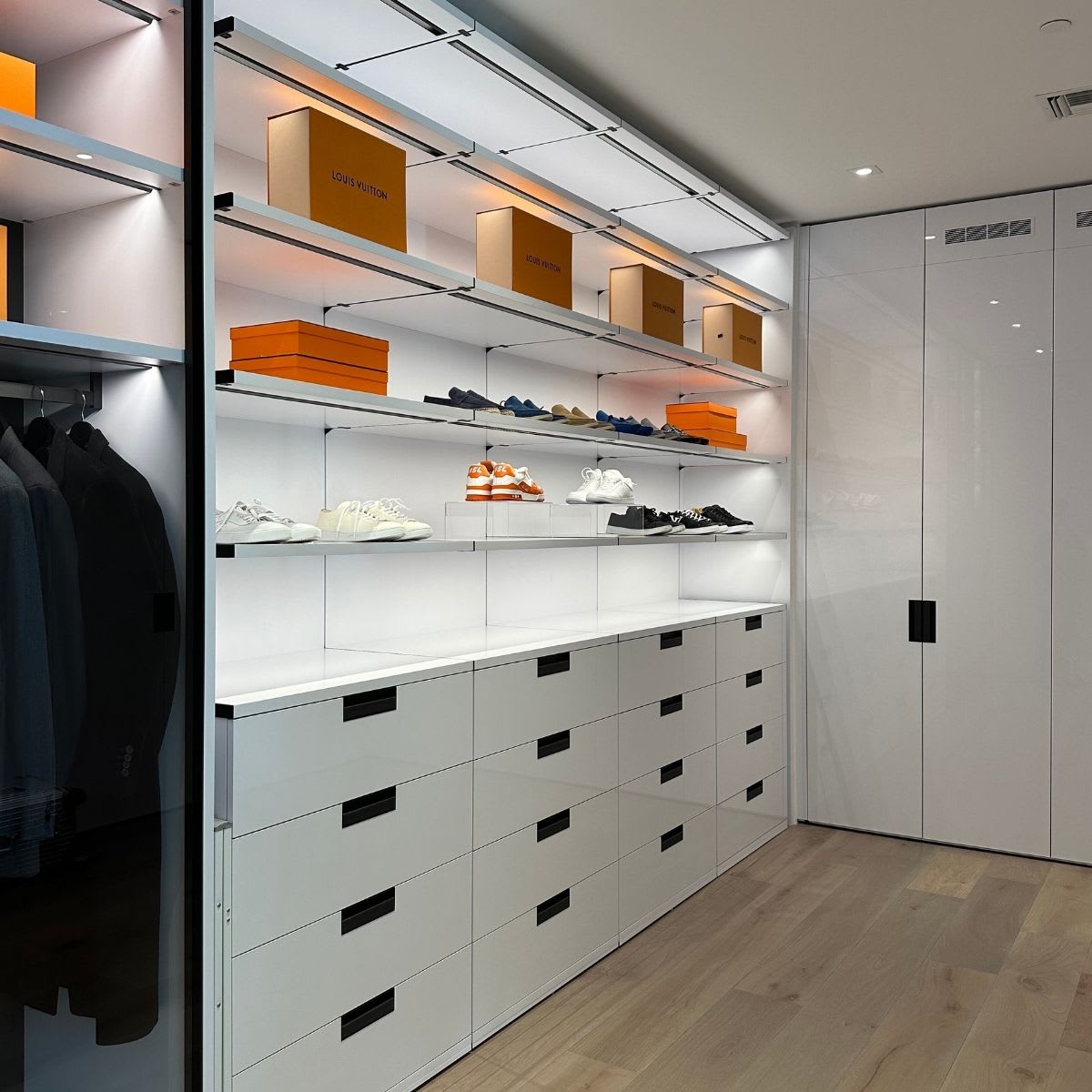 white gloss closet cabinetry designed by eggersmann utilizes pantone's 2026 color of the year