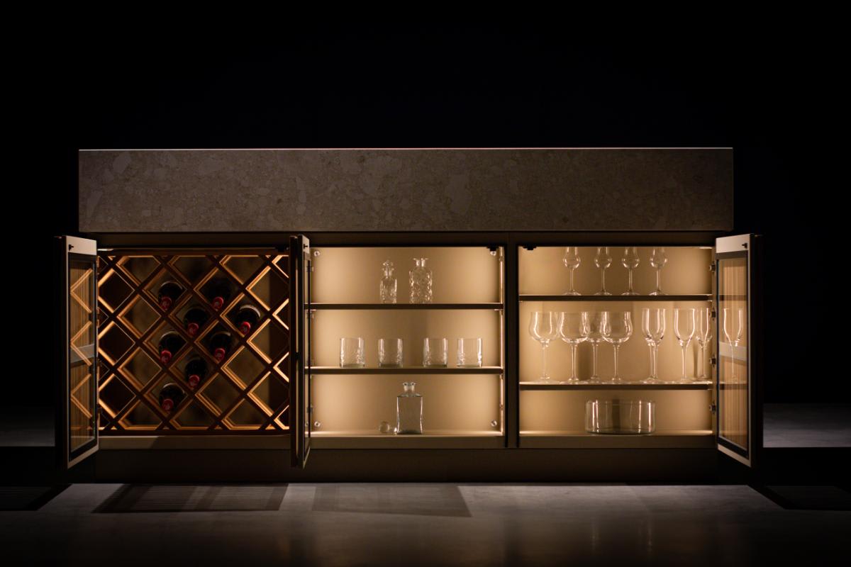 outdoor floating bar counter closed over sink and doors open to reveal built-in led lighting, designed by eggersmann usa and cubic outdoor living