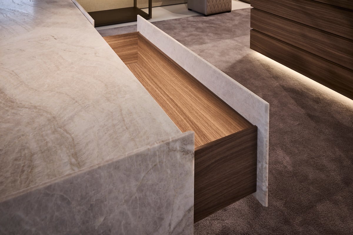 luxurious wooden drawer open in a stone credenza by schmalenbach
