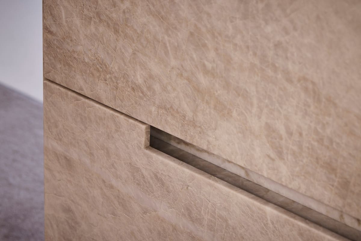 cutaway handle in a drawer of a stone credenza by schmalenbach