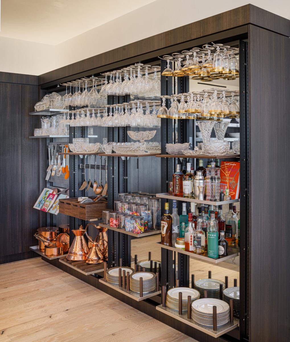 eggersmann-designed concealed kitchen work's pantries all open in a residence of the belfiore high rise in houston tx
