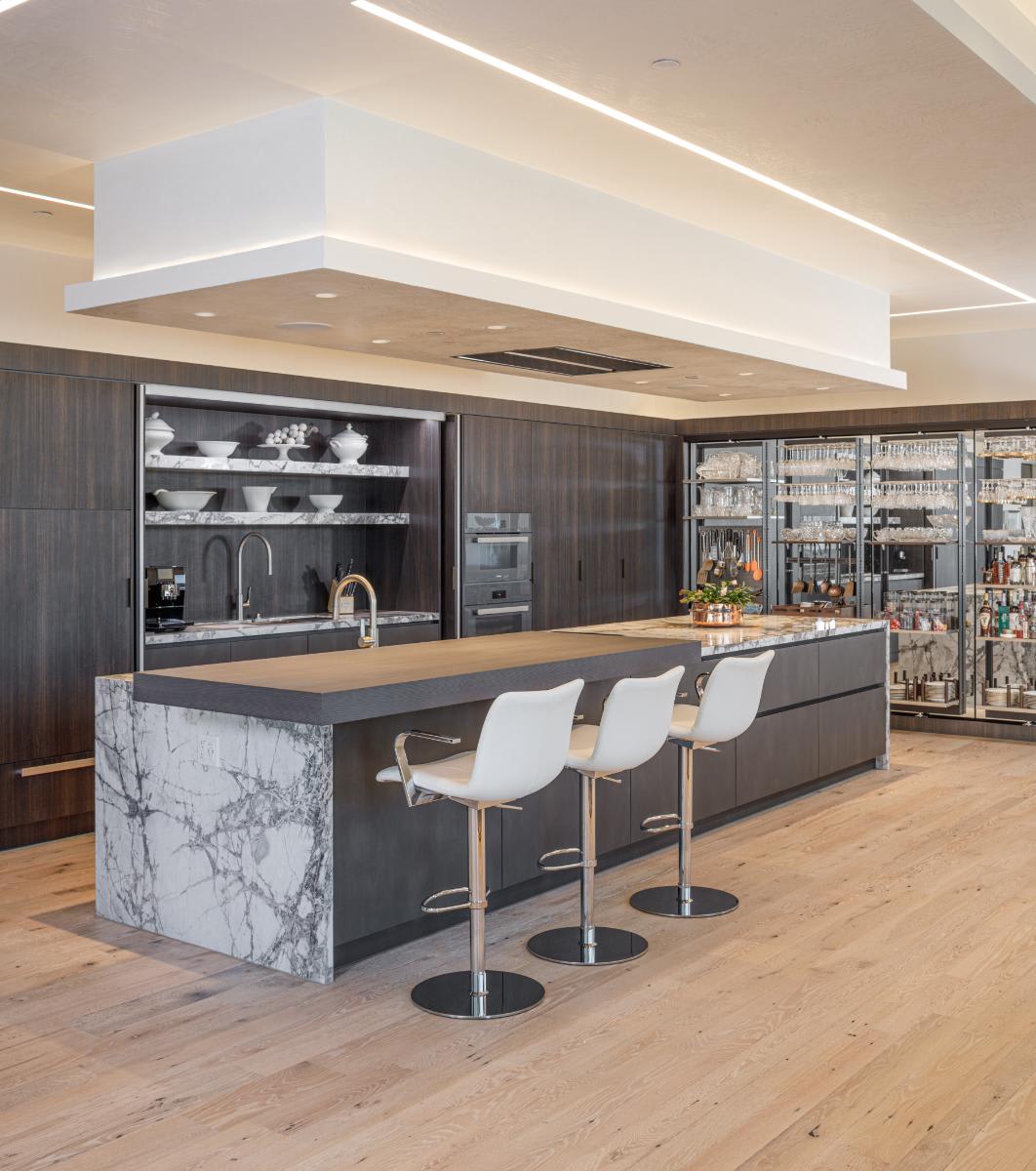 eggersmann-designed concealed-kitchen revealed in a residence of the belfiore high rise in houston tx
