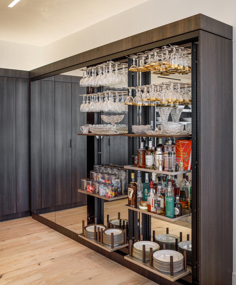 eggersmann-designed concealed kitchen work's pantries open in a residence of the belfiore high rise in houston tx