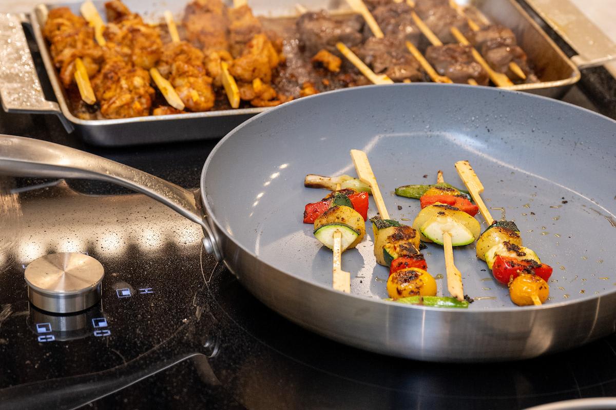 preparing various skewers for guests at the evening of design and culinary excellence event in the eggersmann Houston showroom
