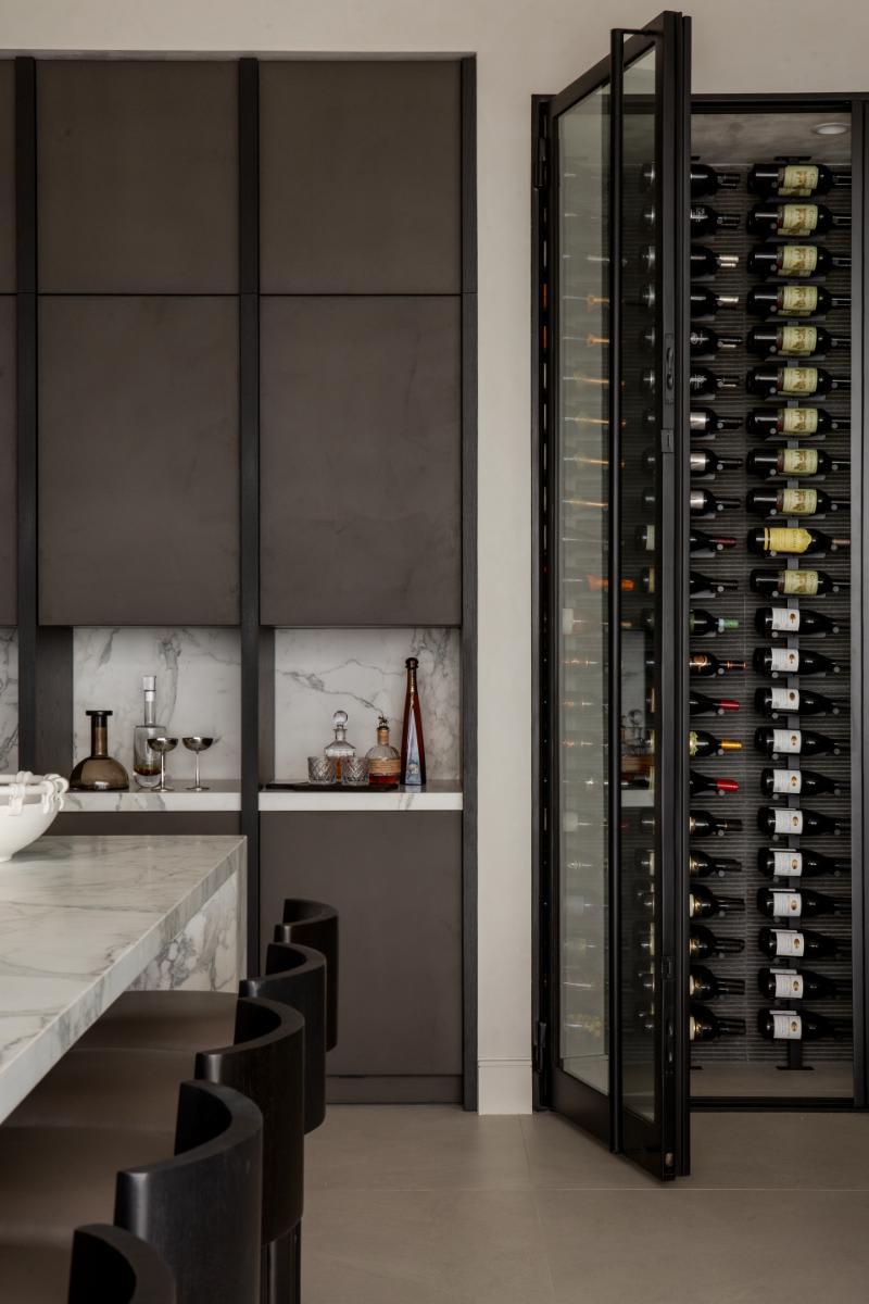tall wine fridge with glass front in a luxury kitchen designed by eggersmann laguna for a home in corona del mar