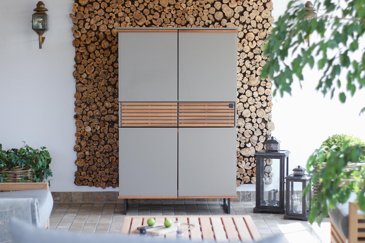 closed modular kitchen in a cupboard with wood slat accents
