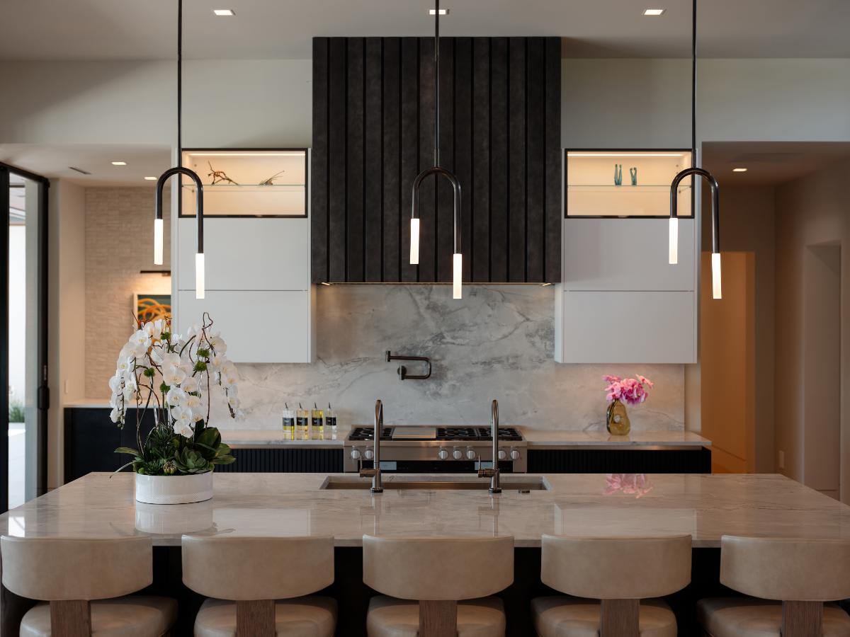 kitchen island and custom stove hood in a luxury modern kitchen designed by eggersmann in a david lewis home