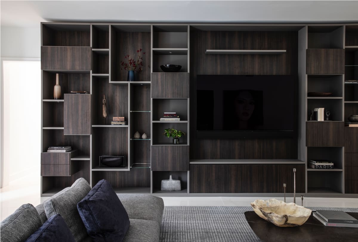 eggersmann-designed wall unit with meda storage and open display in a vastu-driven Houston home renovation by nina magon