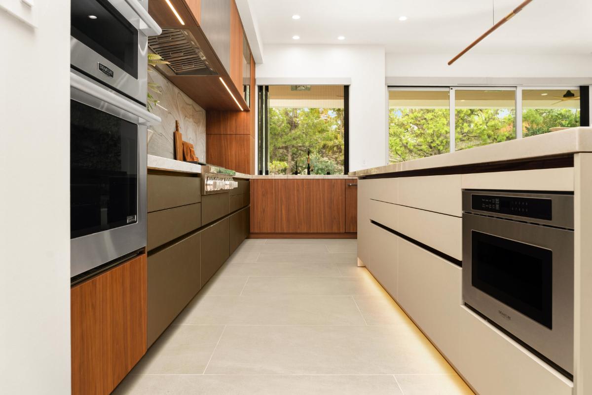 galley of a modern luxury kitchen designed by eggersmann laguna for a renovated newport beach home