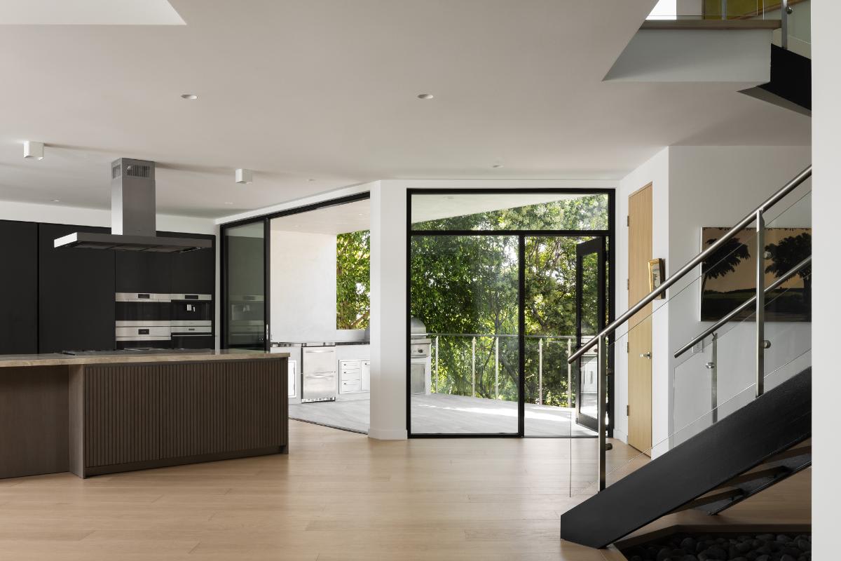 exterior glass doors provide quick access to the eggersmann-designed kitchen of a lagunitas home in laguna beach california