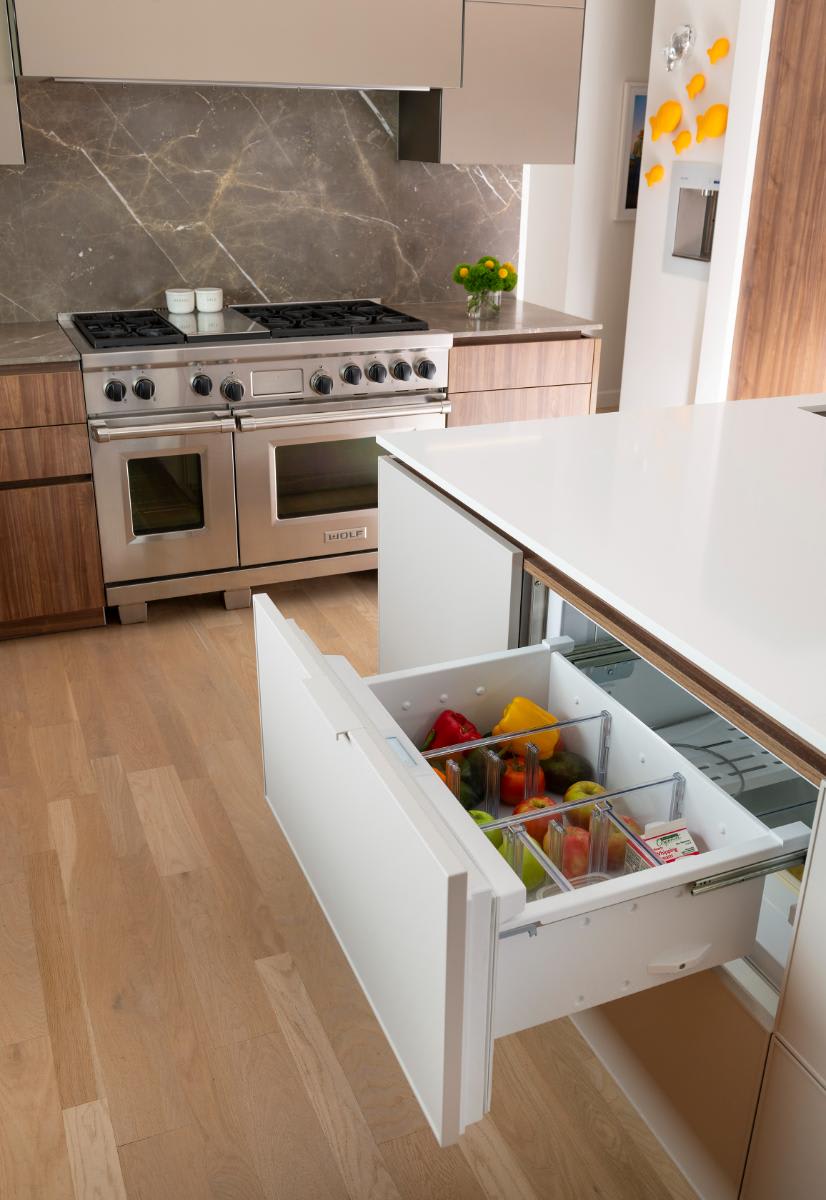 refrigerated drawer in mid-century inspired white kitchen island luxury designed by eggersmann for a Preston Hollow renovation