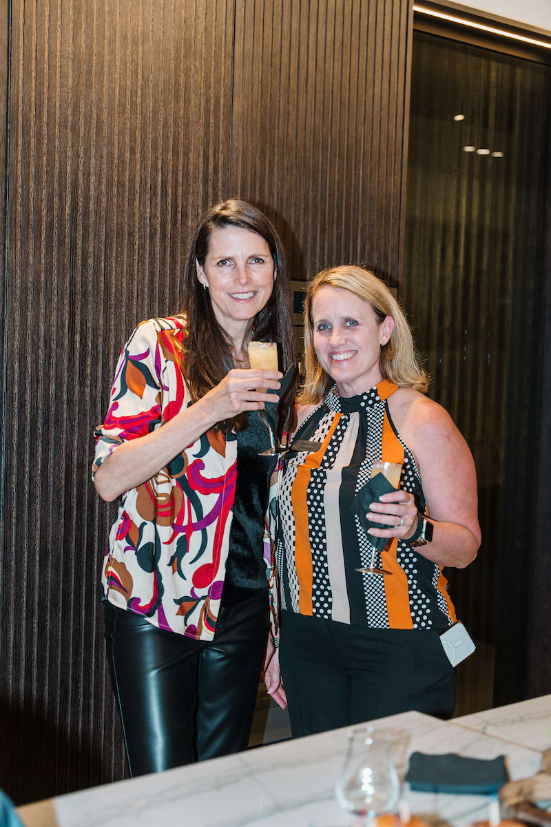 guests pose with shots of tequila at a tequila tasting event at the eggersmann laguna showr
