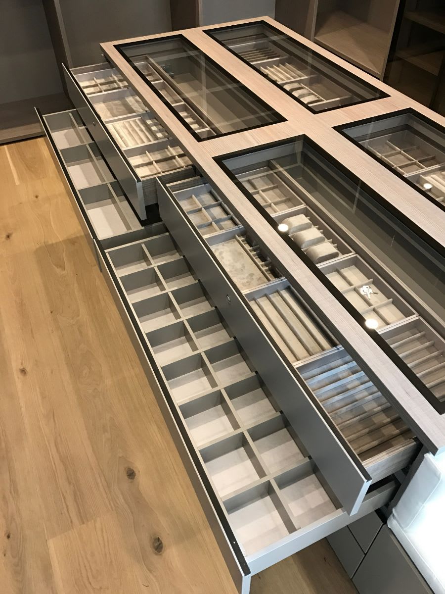 custom luxury jewelry organizers and cubbies in an eggersmann-designed walk-in closet