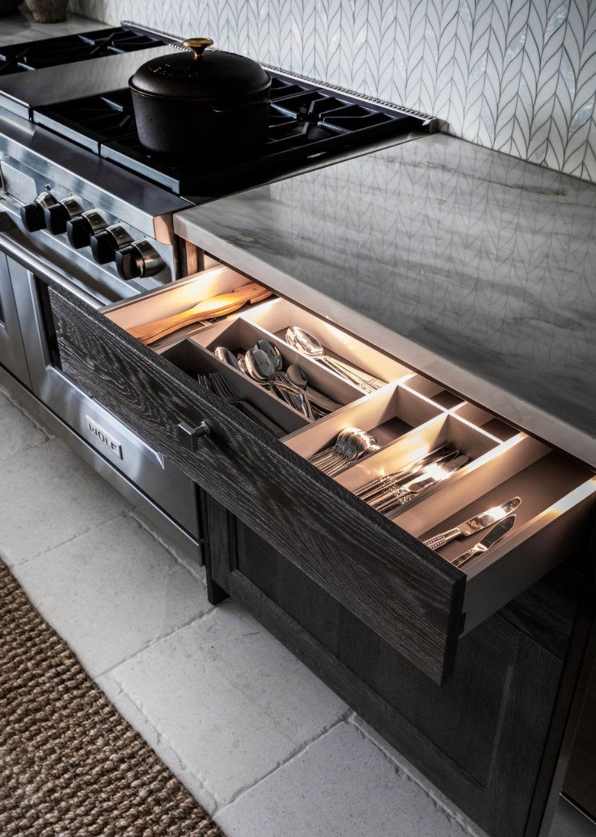 interior lighting inside eggersmann-designed drawer with boxtec organizers for utensils