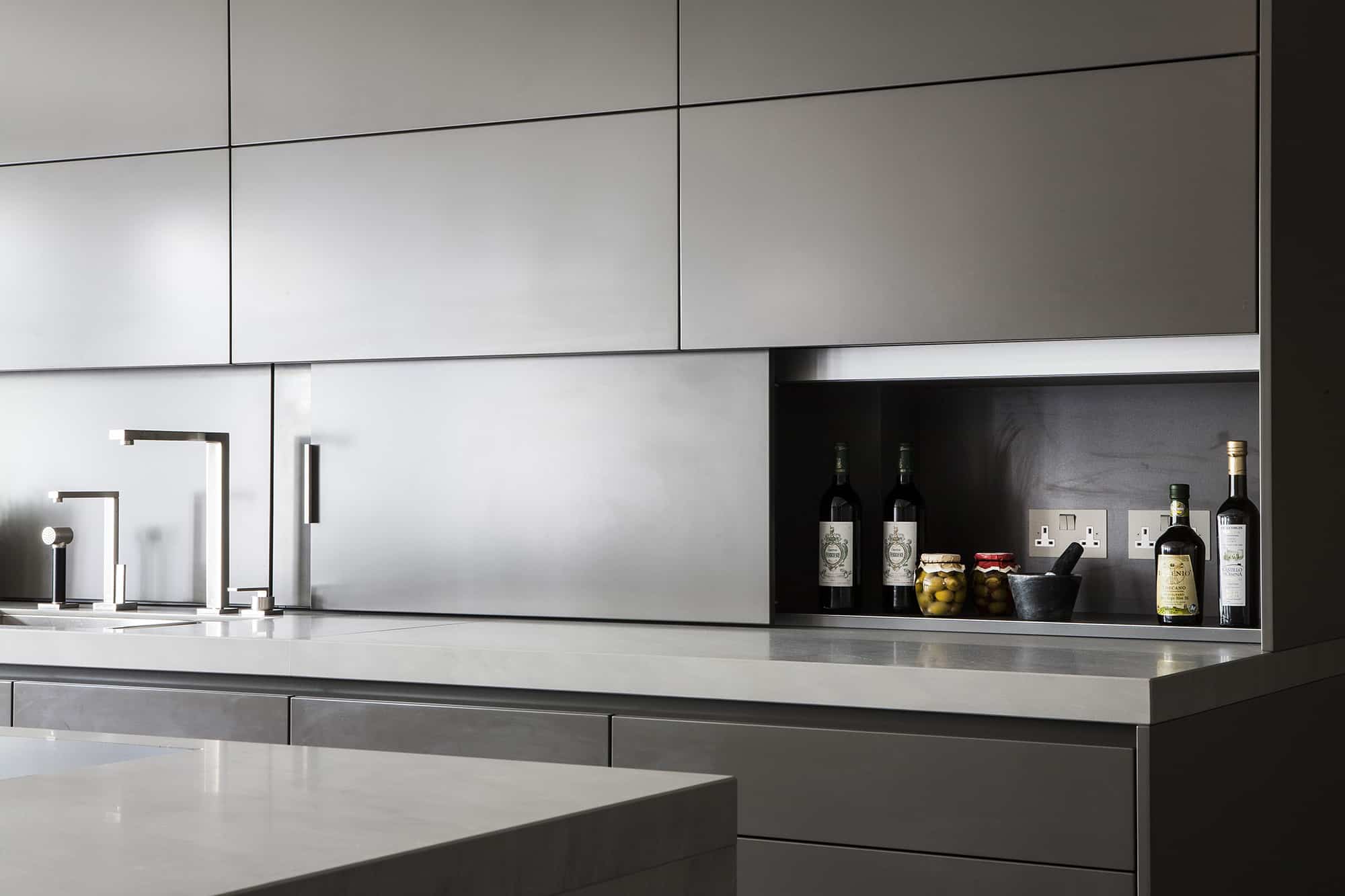 hidden storage in backsplash opened