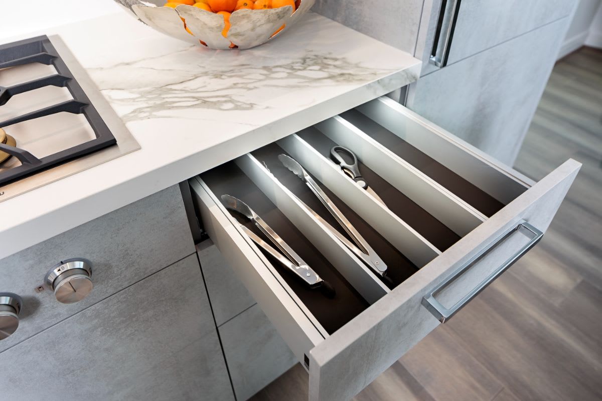 custom kitchen storage for long utensils such as tongs designed by eggersmann using boxtec drawer inserts