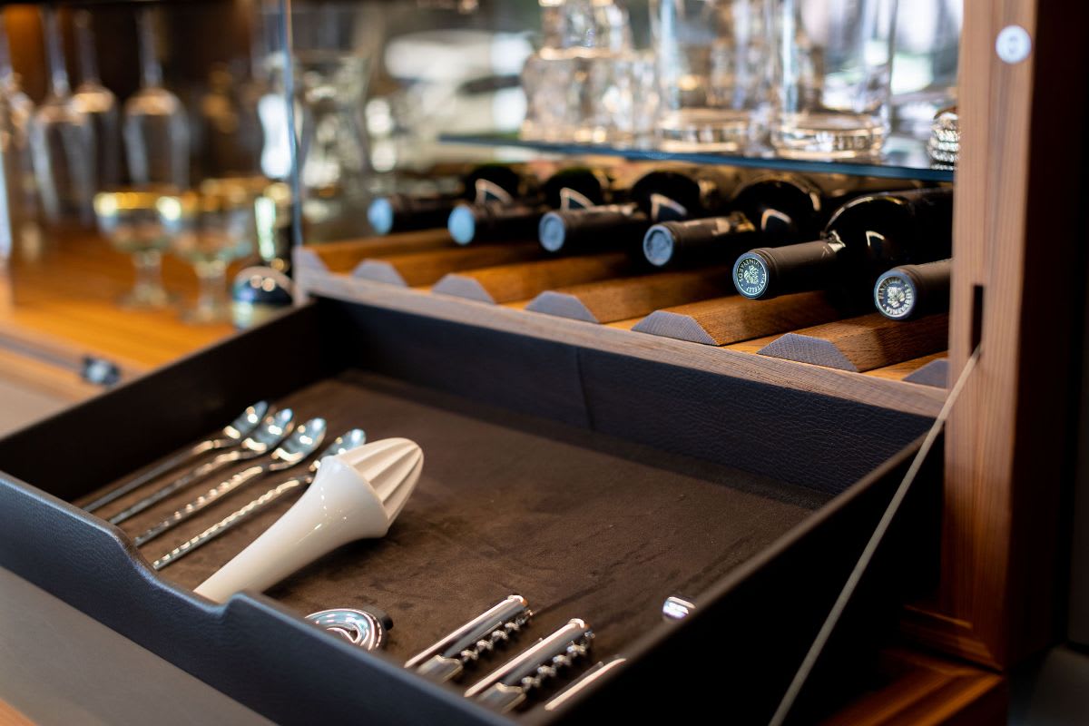 bar utensils in leather-lined drawer of an eggersmann-designed bar