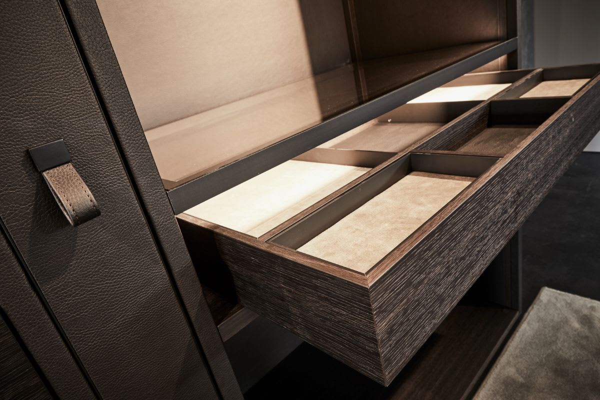 customizable custom drawer inserts organize clothing and accessories in this eggersmann-designed closet