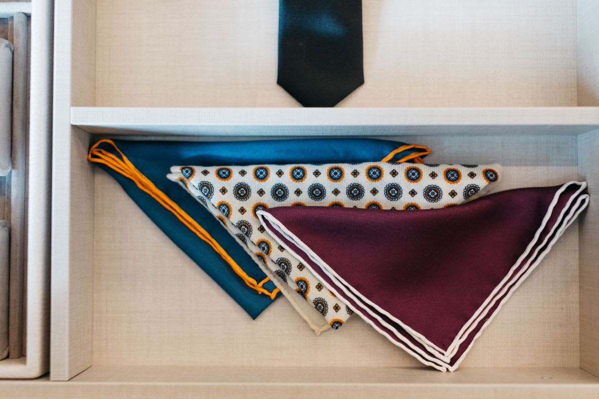 custom drawer inserts organize clothing and accessories in this eggersmann-designed closet