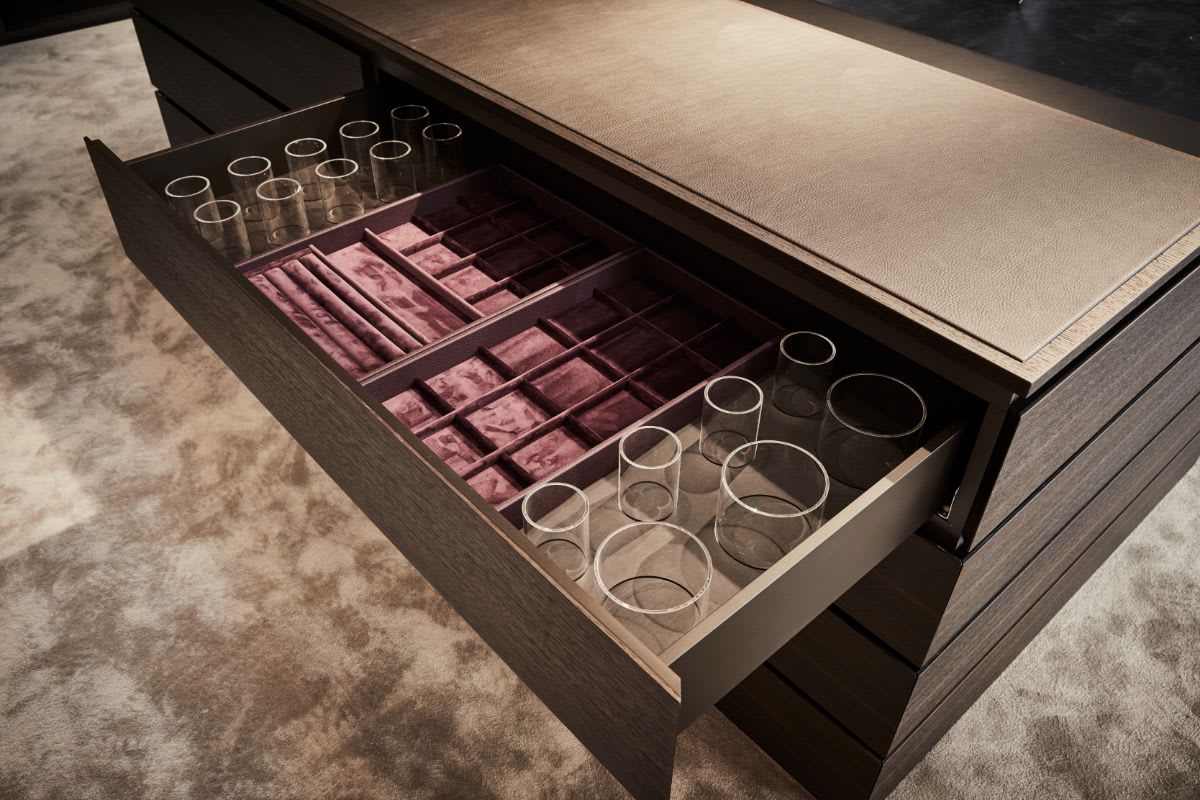 custom velvet-lined jewelry drawer in an island in a walk-in wardrobe designed by eggersmann