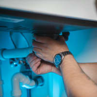 Engineer repairing a domestic boiler