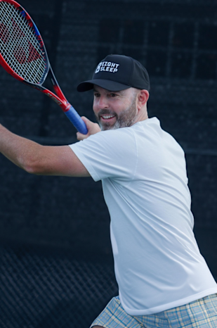Jamie Delgado mid-swing on court