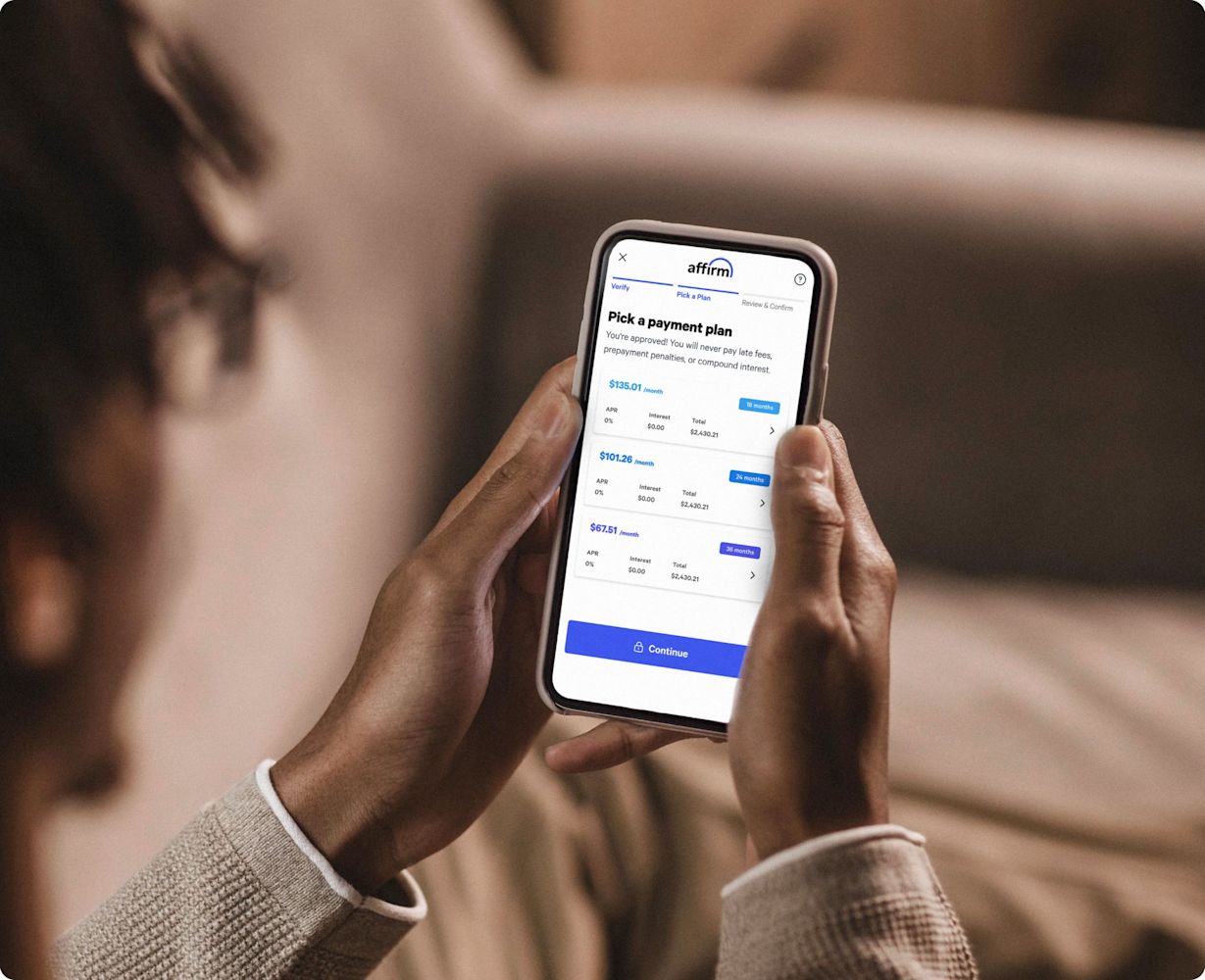 Person using phone to explore payment plan options