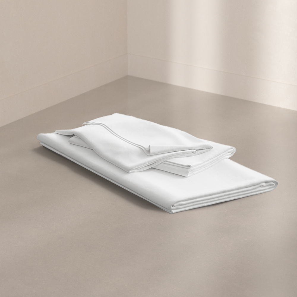 The Pod Sheet Set folded on a studio floor.