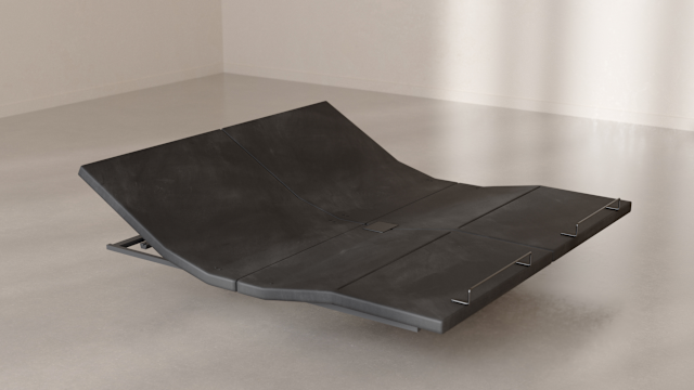 The Base articulated at the head and foot, resting on the floor in a bright room.