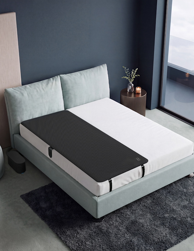A Pod Cover on one side of a queen bed