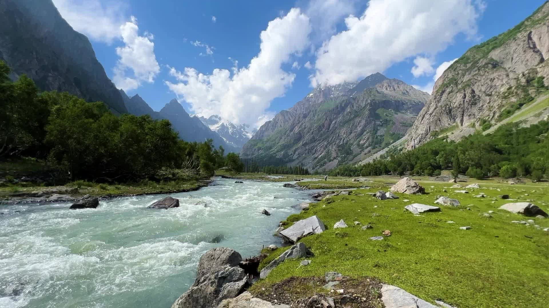 The Parvati river running through the valley below snow-capped peaks