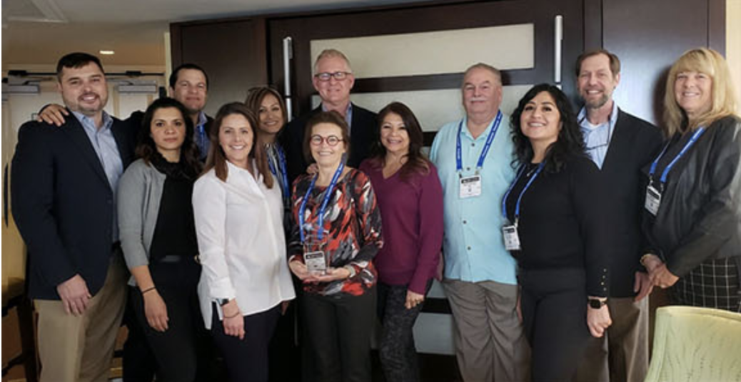 EIS employees accept Treston award for Distributor of the Year