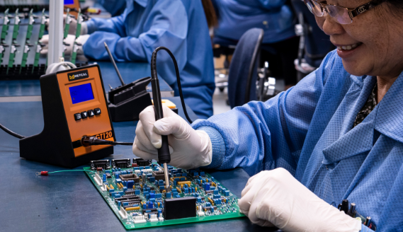 Woman using Metcal soldering station