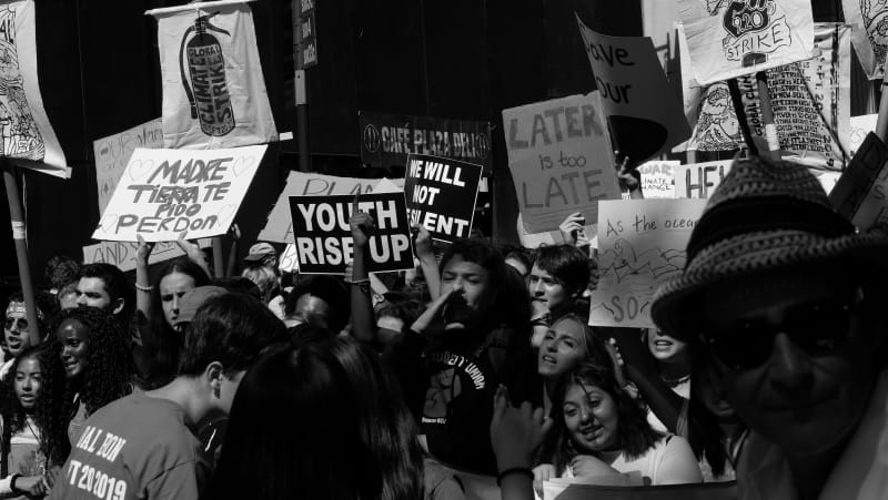 “Global climate strike” “We will not be silent” “Youth rise up” “Later is too late” – a noisy contingent of the climate march chants as they wave their plentiful signs