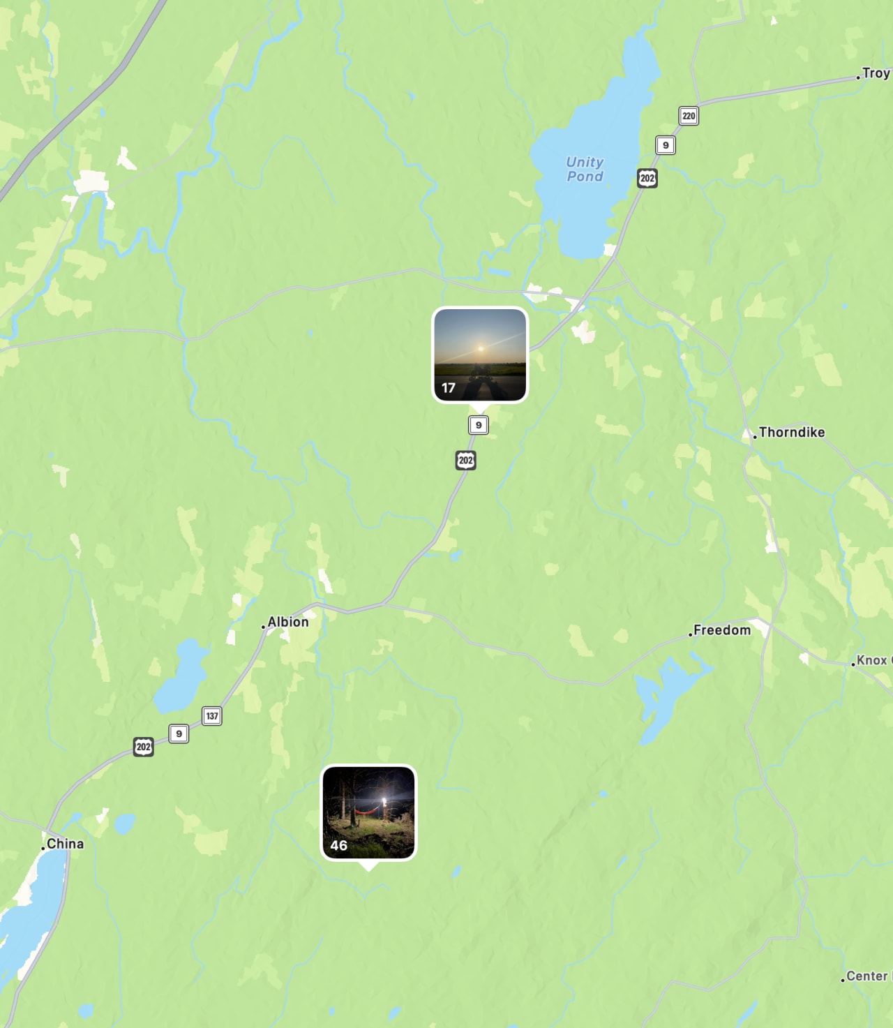 Map of rural Maine showing Highway 202 corridor with two nighttime landscape photos pinned at locations near Troy and Albion.