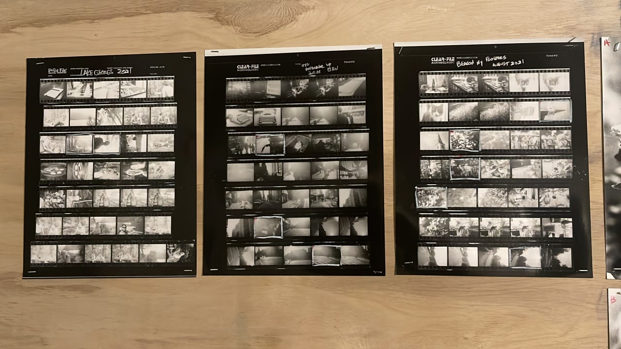 Three contact sheets of black and white film negatives showing various scenes from what appears to be a documentary or artistic photo project. Three contact sheets of black and white film negatives showing various scenes from what appears to be a documentary or artistic photo project.