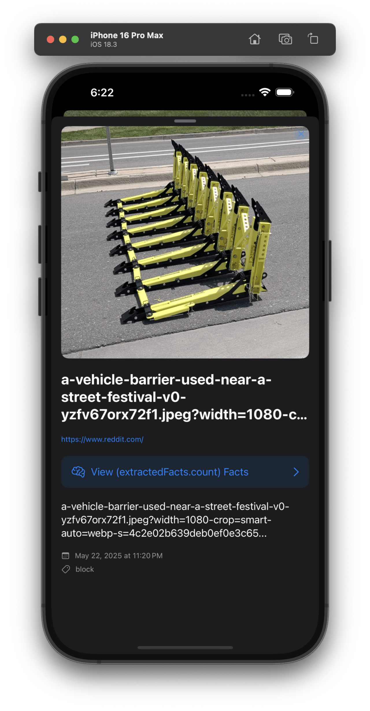 Yellow and black vehicle barrier fencing stacked on a road near a street festival