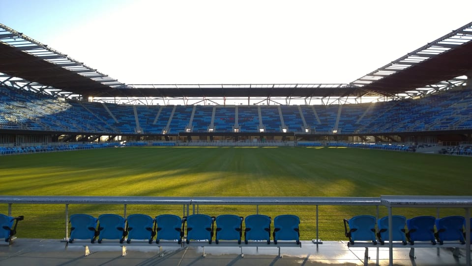 Empty blue stands and the grass field at Avaya Stadium in San Jose, California, photographed in January 2015.
