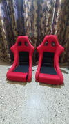 2 Red and Black Fiber Racing Bucket Seat.