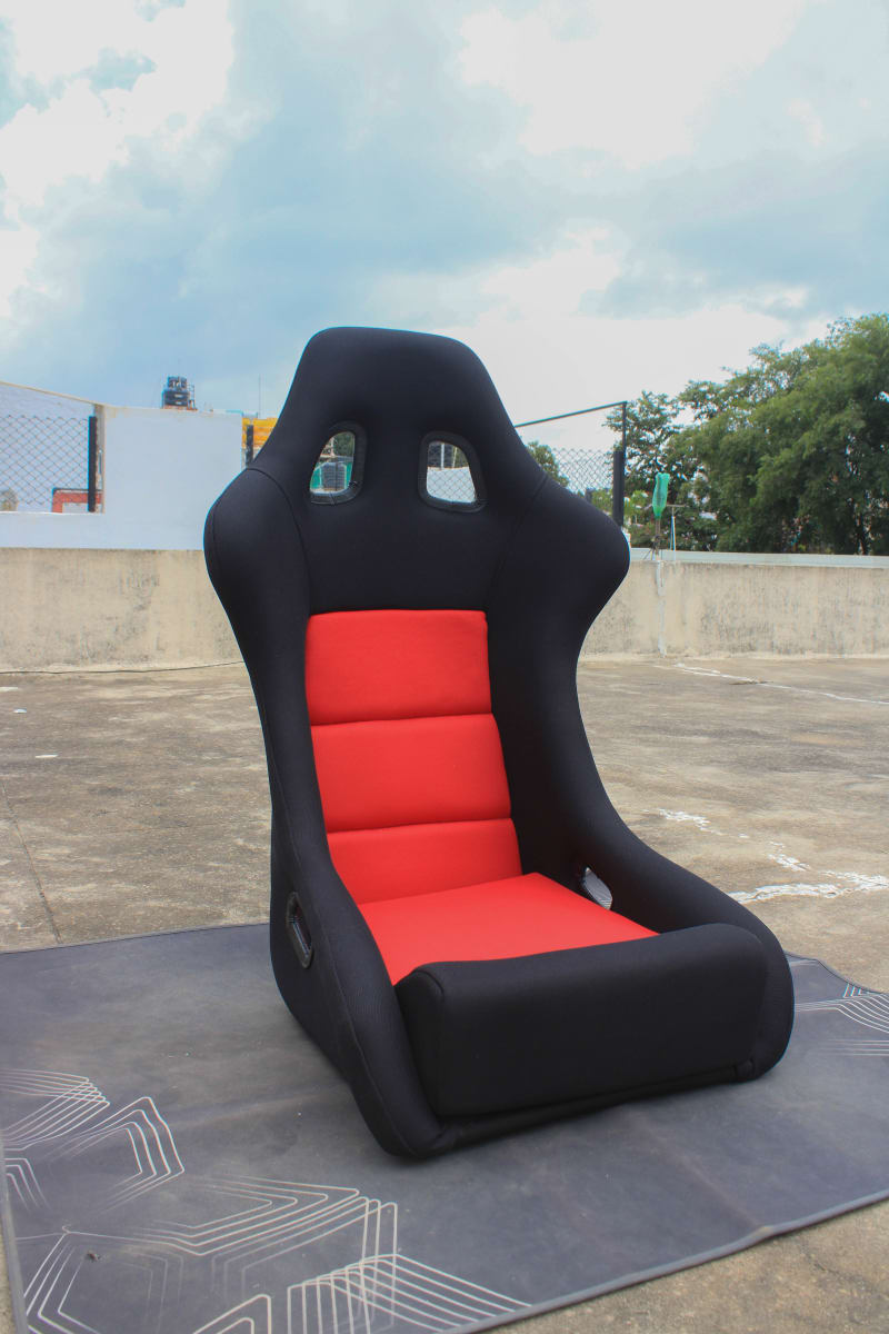 Black Fiber Racing Bucket Seat on a Wooden table.