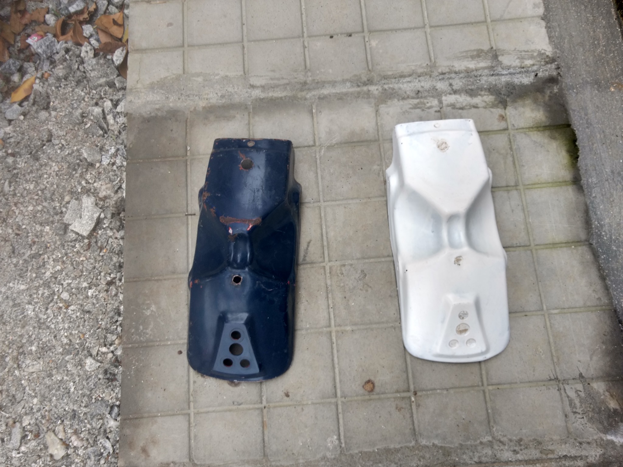 2 Pieces of Bajaj SX Enduro Back Mudguard (Rear Fender). 1 is Metal and 1 is Fiberglass