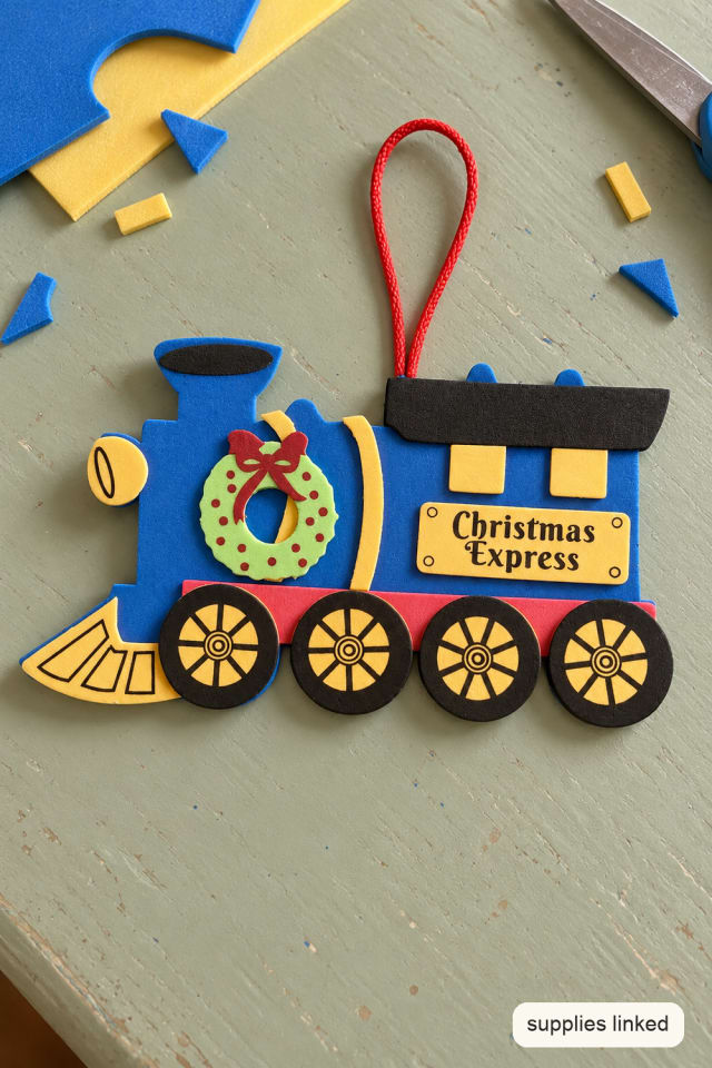 Foam Christmas Train Craft Kit with a Wreath and Gold Wheels maker-lifestyle pin