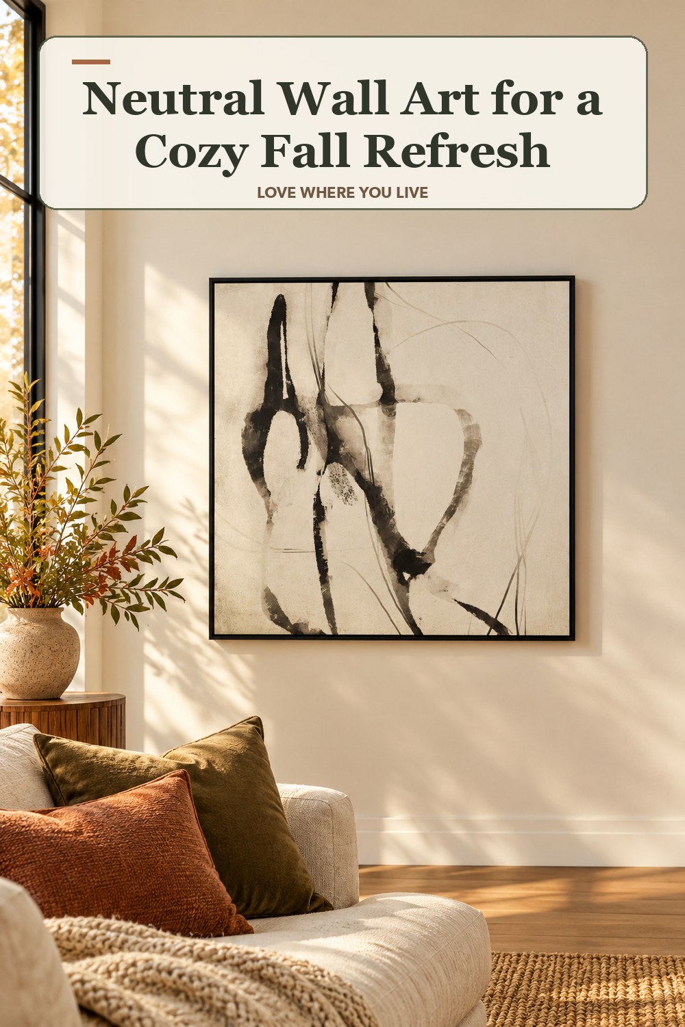 Lived-in fall room with a neutral wall art and the headline: Neutral Wall Art for a Cozy Fall Refresh.