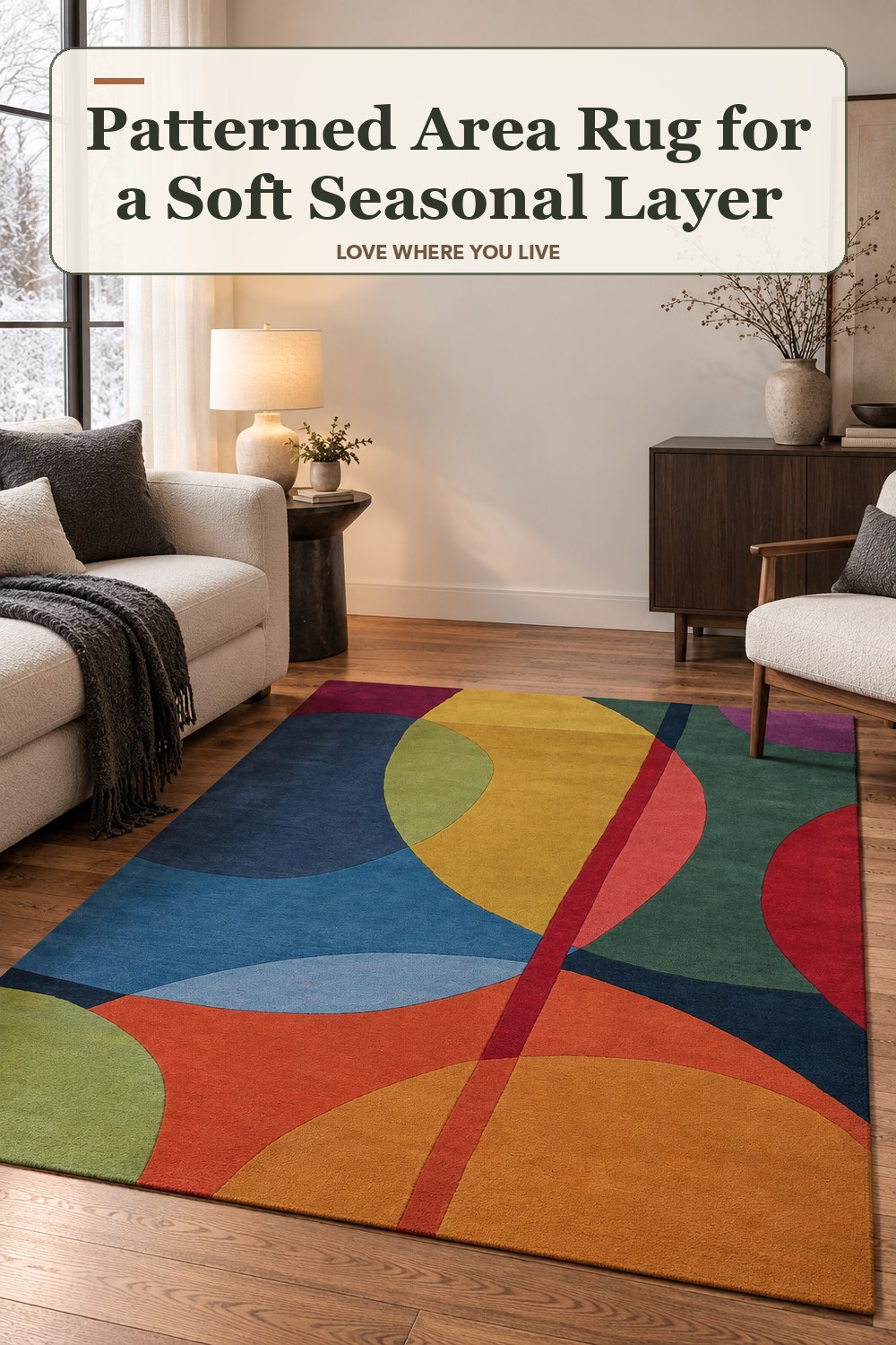 Lived-in winter room with a patterned area rug and the headline: Patterned Area Rug for a Soft Seasonal Layer.