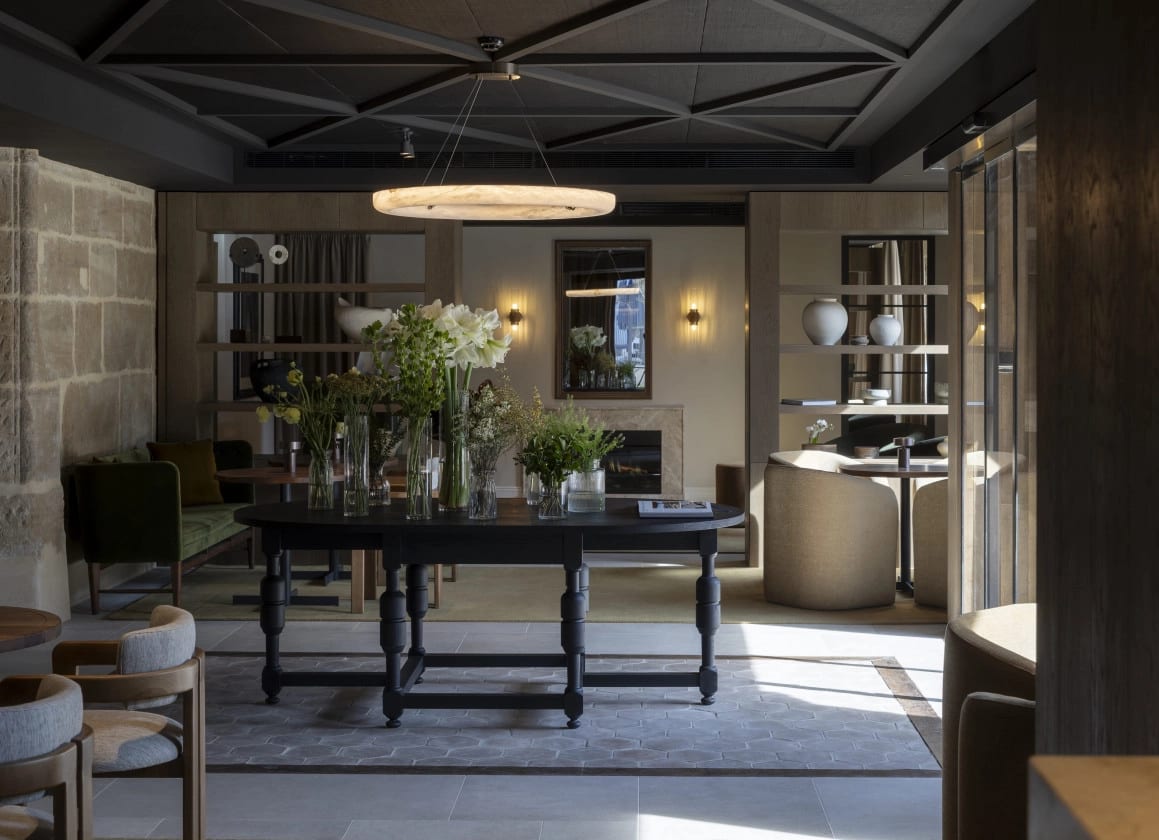 The dining room at Palacio de los Ángeles, with exposed stone and understated furniture