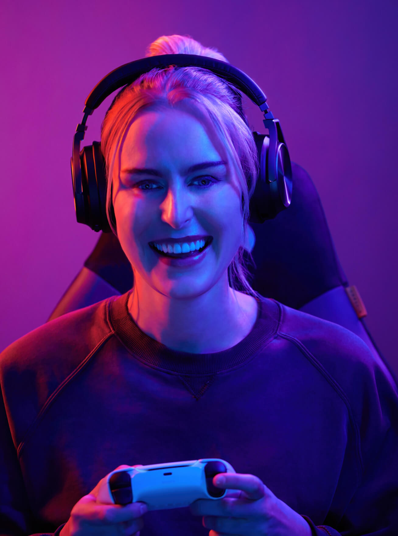 Female streamer playing game with headsets on