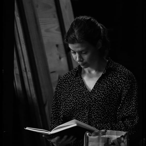 Elisabeth reading her notes.